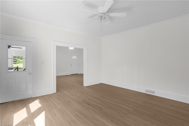 4221 Old Greensboro Rd, Winston-Salem, NC 27101 - empty room featuring ceiling fan, crown molding, light wood-style floors, and baseboards