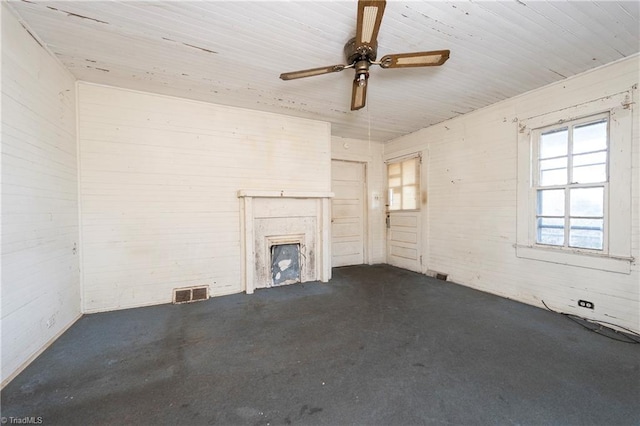 unfurnished living room with ceiling fan