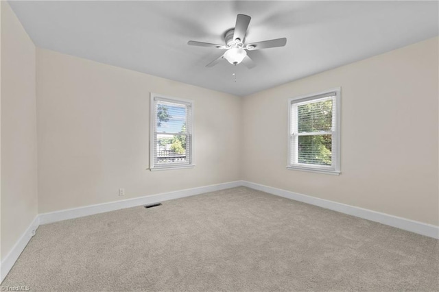 unfurnished room featuring carpet floors and ceiling fan