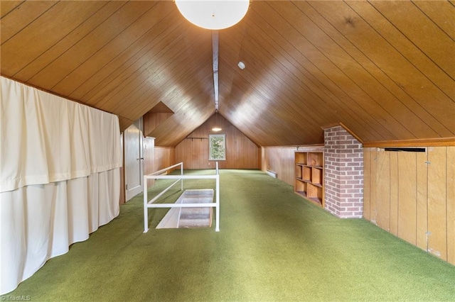 additional living space featuring vaulted ceiling, dark carpet, brick wall, wood walls, and wooden ceiling