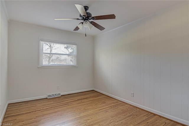 unfurnished room with ceiling fan, crown molding, and light hardwood / wood-style flooring