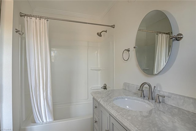 bathroom with vanity, crown molding, and shower / tub combo with curtain