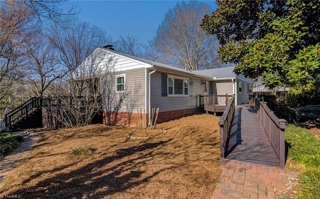 view of front of house featuring a wooden deck