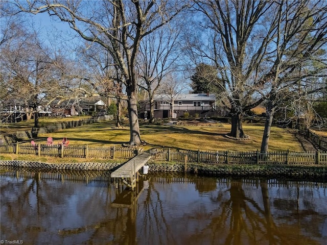 exterior space featuring a yard and a water view