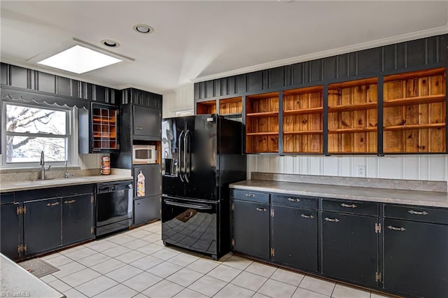 kitchen with sink, light tile patterned flooring, black appliances, and ornamental molding