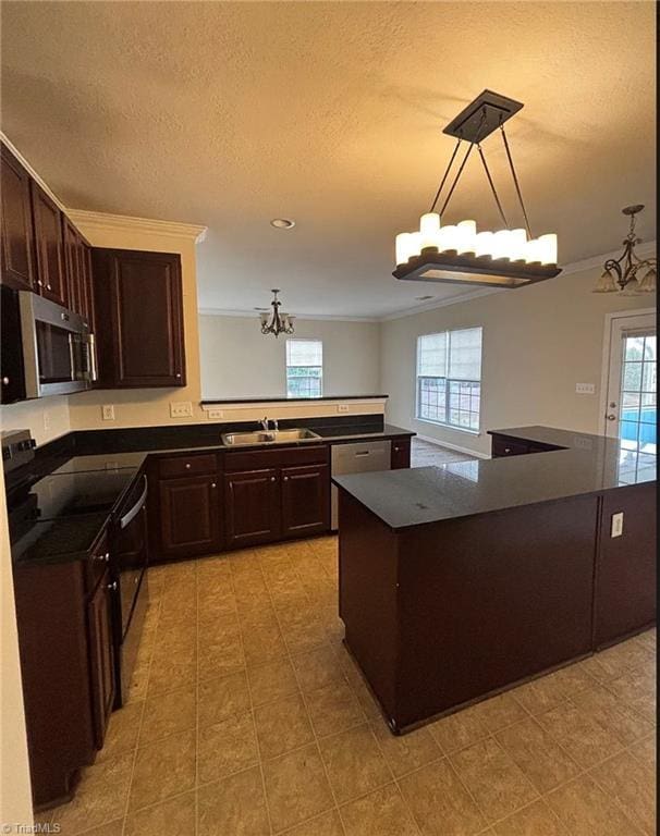 5608 David Christian Pl, Greensboro, NC 27410 - kitchen featuring stainless steel microwave, a sink, electric range, a chandelier, and healthy amount of natural light