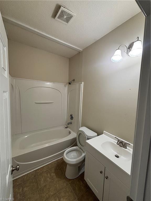 5608 David Christian Pl, Greensboro, NC 27410 - full bath featuring vanity, toilet, shower / bathtub combination, a textured ceiling, and tile patterned flooring