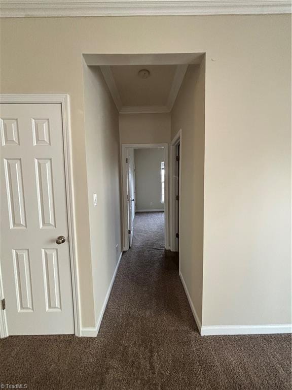 5608 David Christian Pl, Greensboro, NC 27410 - hallway featuring dark carpet, baseboards, and crown molding