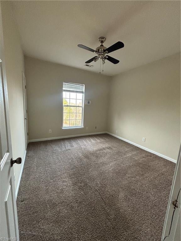 5608 David Christian Pl, Greensboro, NC 27410 - carpeted spare room with ceiling fan and baseboards