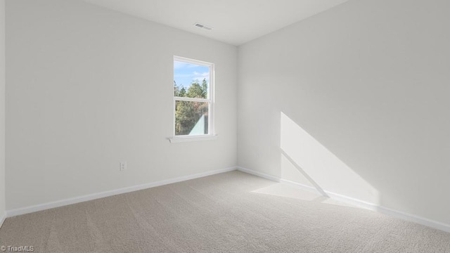 6601 Grogan Hill Rd, Whitsett, NC 27377 - carpeted empty room featuring baseboards