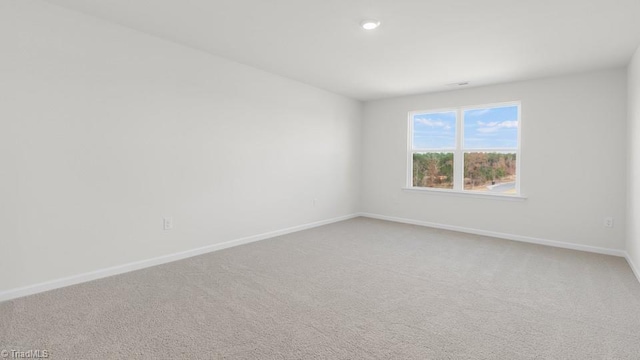 6601 Grogan Hill Rd, Whitsett, NC 27377 - spare room with light carpet and recessed lighting