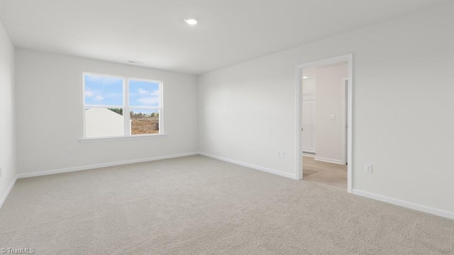 6601 Grogan Hill Rd, Whitsett, NC 27377 - empty room with carpet floors and baseboards