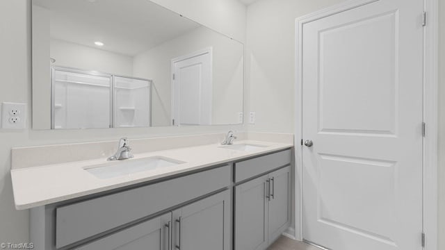 6601 Grogan Hill Rd, Whitsett, NC 27377 - full bath featuring double vanity and a shower with shower door