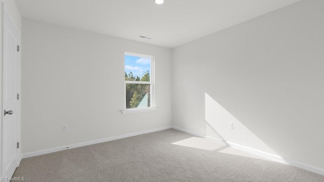 6601 Grogan Hill Rd, Whitsett, NC 27377 - carpeted empty room with baseboards and recessed lighting