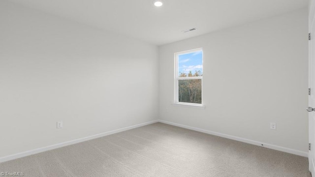 6601 Grogan Hill Rd, Whitsett, NC 27377 - unfurnished room with light colored carpet and recessed lighting