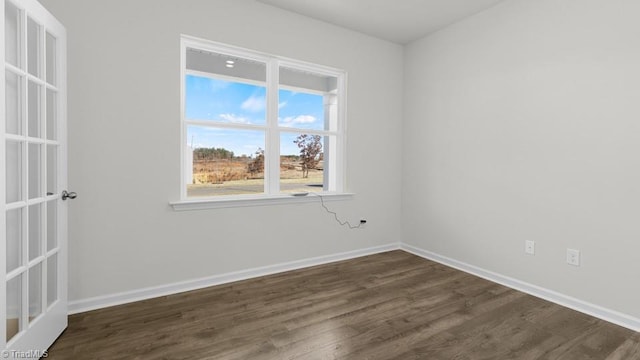 6601 Grogan Hill Rd, Whitsett, NC 27377 - empty room featuring dark wood-style floors and baseboards
