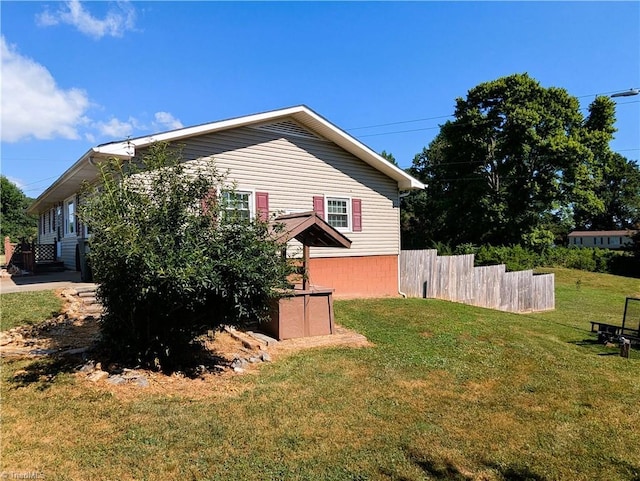 view of home's exterior with a lawn