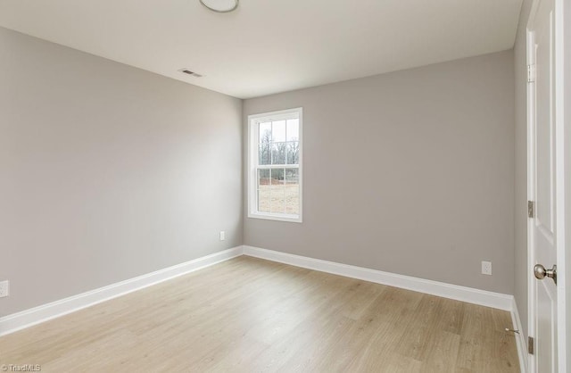 empty room with light wood-type flooring