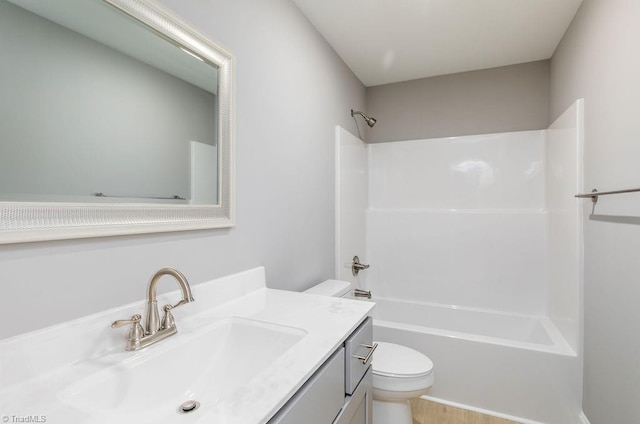 full bathroom featuring vanity, shower / tub combination, and toilet