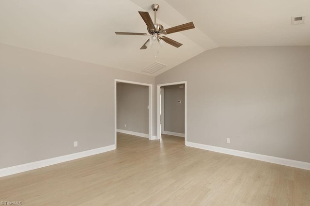 unfurnished room with ceiling fan, lofted ceiling, and light wood-type flooring