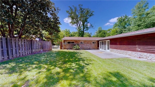 3618 Rockwood Dr, High Point, NC 27265 - back of property featuring a yard, fence, and a patio area