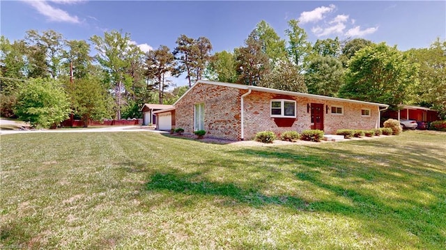 3618 Rockwood Dr, High Point, NC 27265 - view of side of home featuring a lawn, brick siding, and a garage