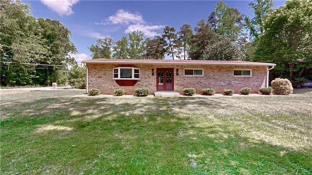 3618 Rockwood Dr, High Point, NC 27265 - ranch-style home featuring brick siding and a front lawn