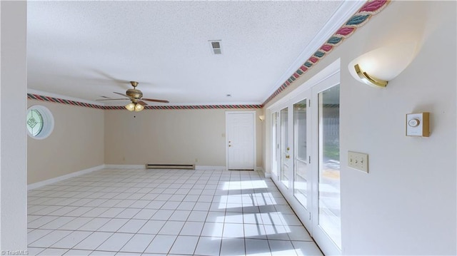 3618 Rockwood Dr, High Point, NC 27265 - spare room featuring ceiling fan, a textured ceiling, a baseboard heating unit, light tile patterned floors, and baseboards
