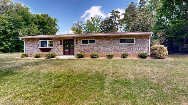 3618 Rockwood Dr, High Point, NC 27265 - ranch-style house with brick siding, a front lawn, and french doors