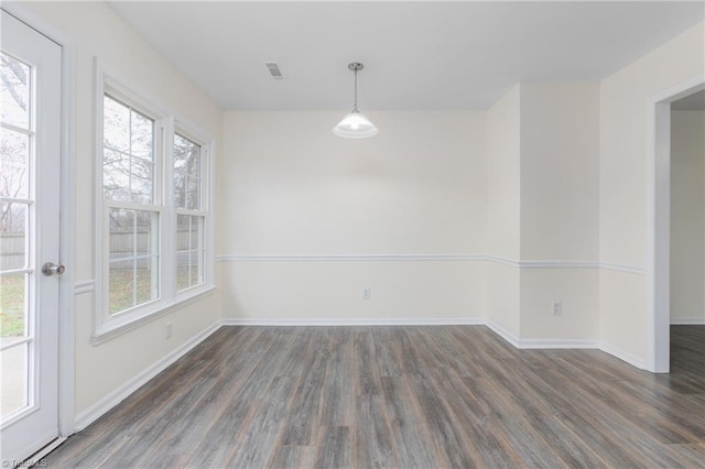 unfurnished dining area with dark hardwood / wood-style floors