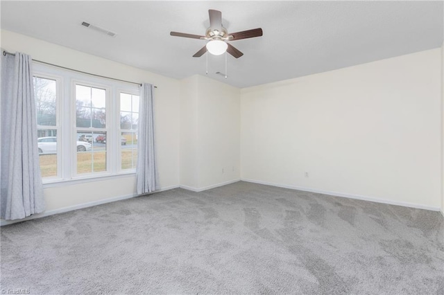 empty room with light carpet and ceiling fan