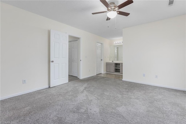 carpeted empty room featuring ceiling fan