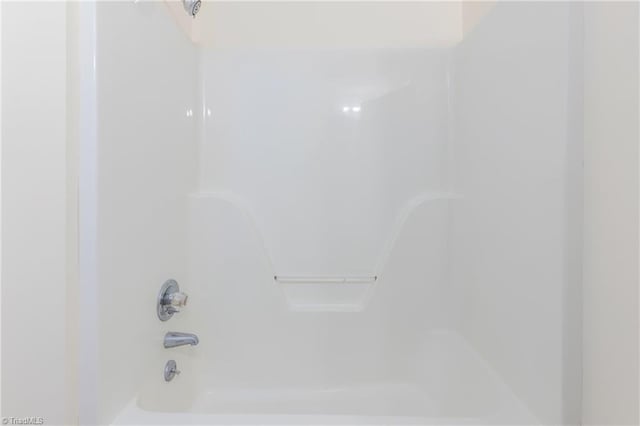 bathroom with shower / washtub combination