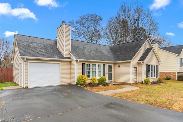 view of front of home featuring a garage and a front yard