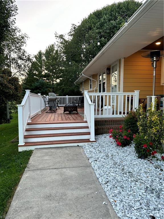 wooden terrace with area for grilling