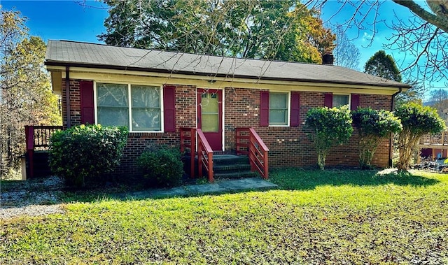 ranch-style house with a front lawn