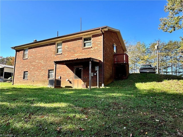 back of property with a lawn