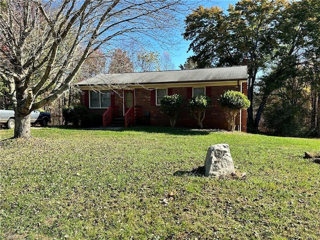 single story home with a front yard