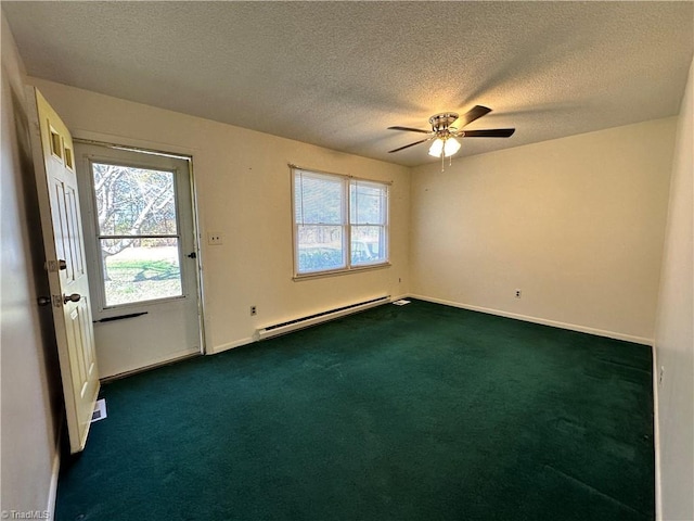 unfurnished room with plenty of natural light, dark colored carpet, a textured ceiling, and baseboard heating