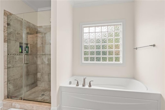 bathroom featuring crown molding and plus walk in shower