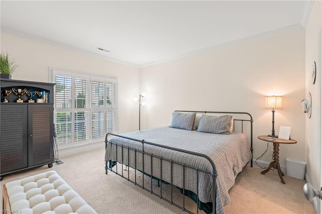 carpeted bedroom with ornamental molding