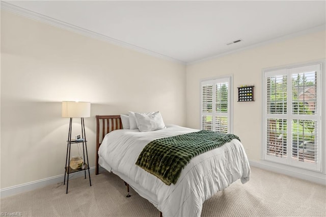 bedroom featuring carpet floors and crown molding