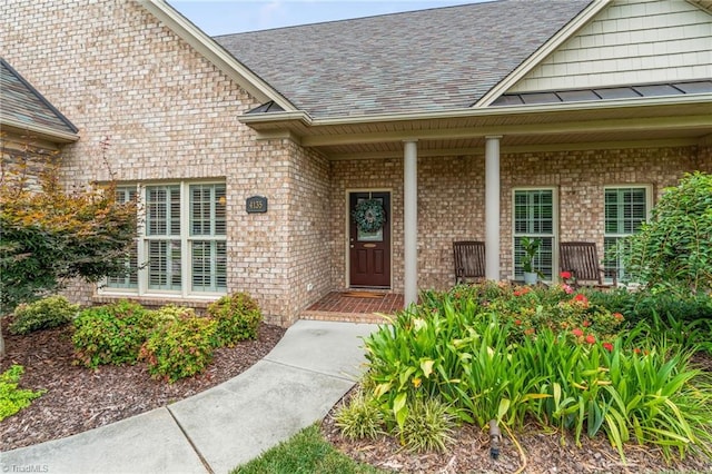 property entrance featuring a porch