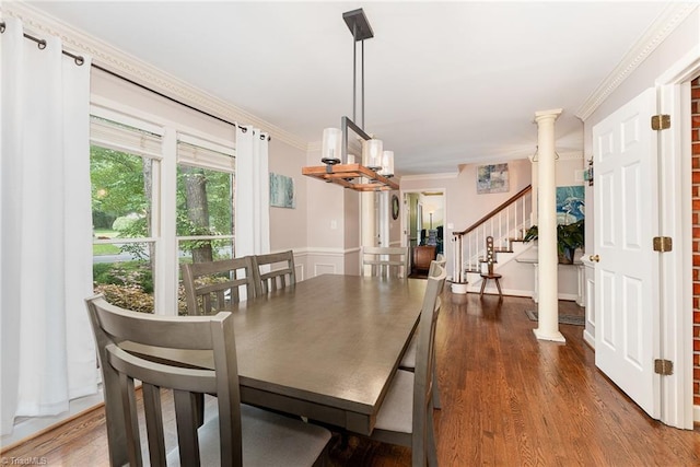 3016 Havasu Way, High Point, NC 27265 - dining area featuring a chandelier, crown molding, stairs, wood finished floors, and a wainscoted wall