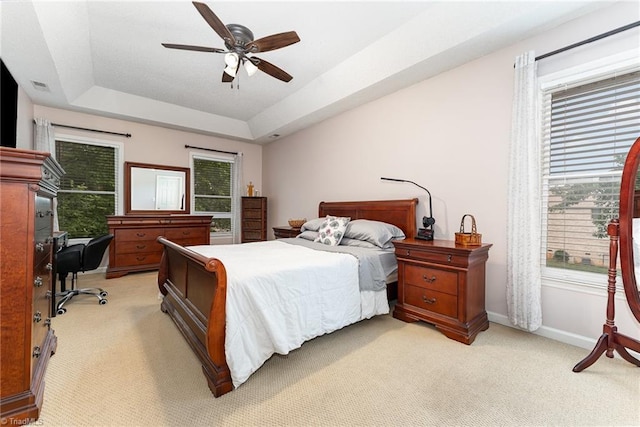 3016 Havasu Way, High Point, NC 27265 - bedroom featuring light colored carpet, a tray ceiling, a desk, and ceiling fan