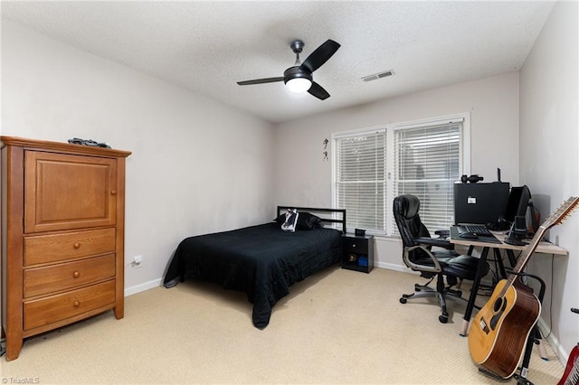 3016 Havasu Way, High Point, NC 27265 - bedroom with a desk, light carpet, a ceiling fan, and a textured ceiling