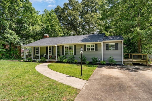 1420 Rankin Rd, Greensboro, NC 27405 - ranch-style home featuring a porch, a chimney, a front lawn, and a wooden deck