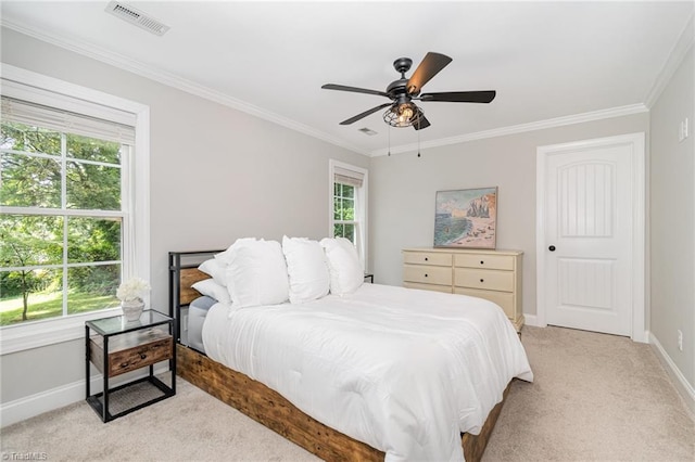1420 Rankin Rd, Greensboro, NC 27405 - bedroom with light colored carpet, multiple windows, ornamental molding, and a ceiling fan