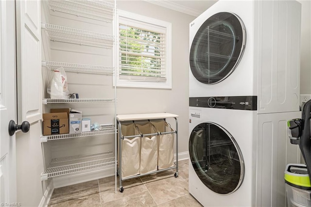 1420 Rankin Rd, Greensboro, NC 27405 - washroom featuring stacked washing machine and dryer and ornamental molding