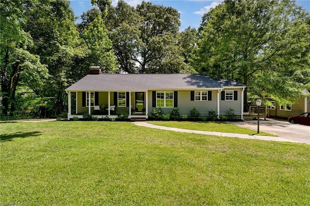 1420 Rankin Rd, Greensboro, NC 27405 - single story home featuring a porch, a front yard, and a chimney